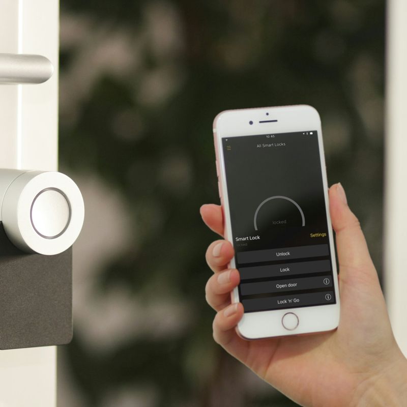 Smart lock on a front door controlled from a smartphone app